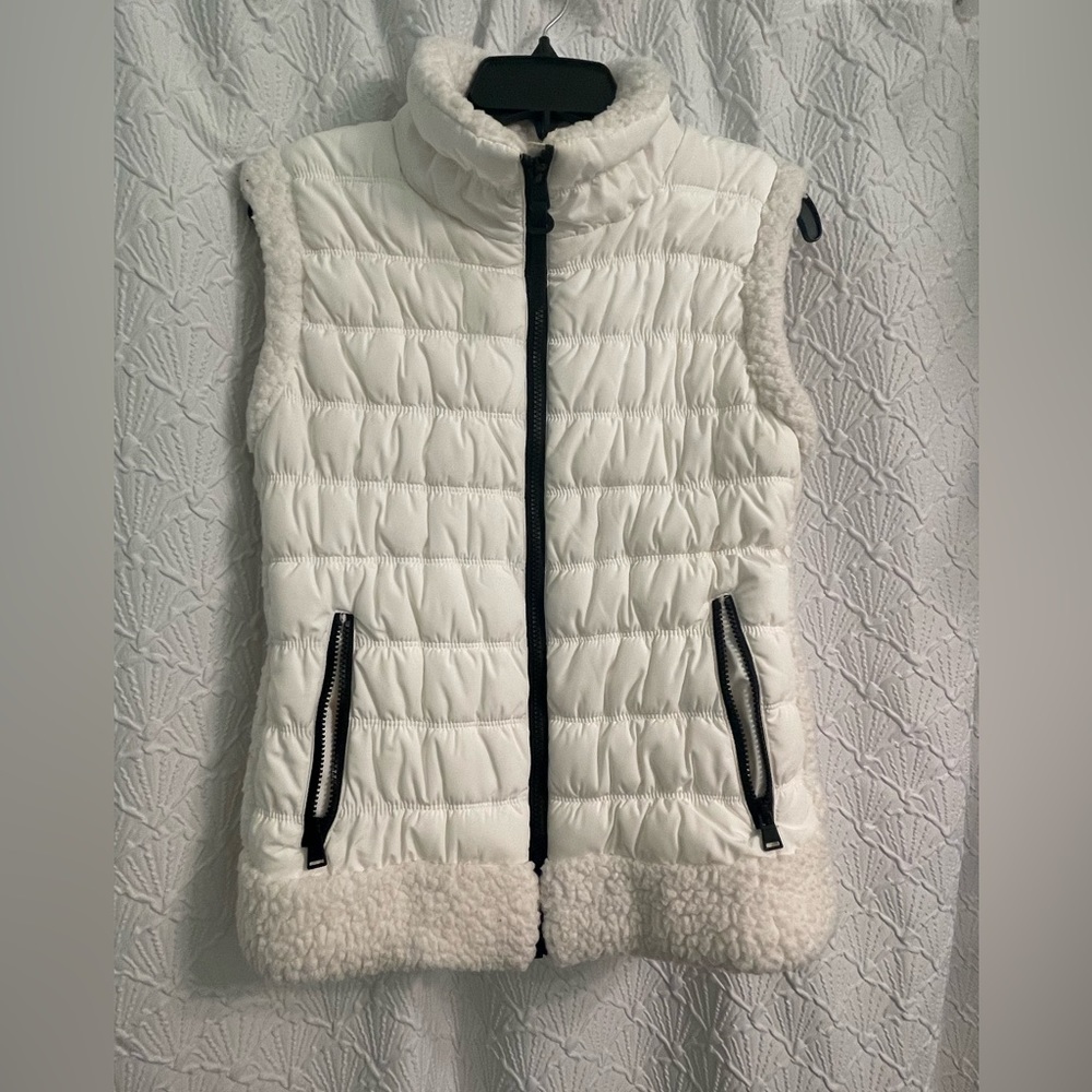 Calvin Klein white puffy vest. Only worn one time. Super cute and comfy!
